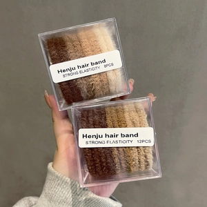 Neutral earth tone braided hair ties set in a clear box with strong elasticity