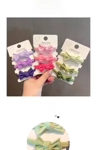 Detailansicht bunter Schleifen-Haargummis in Violett Rosa und Grün als elastische Sets
