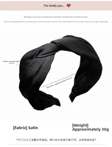 Detail view of black pleated satin headband showing a 6.5cm wide twisted knot texture