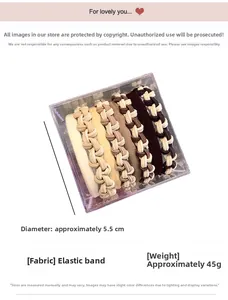 Macro view of six woven elastic hair ties in neutral tones inside a clear acrylic box