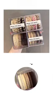 Close-up of high-elasticity braided cotton hair bands in earth tones inside a clear box