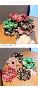 Detailed view of assorted plaid scrunchies in various vintage checkered fabric patterns