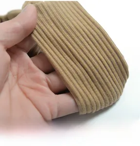 Close-up of khaki ribbed knit fabric showing the detailed texture and elastic material