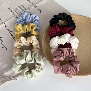 Elegant satin scrunchies set in Morandi colors with smooth silk texture and soft sheen