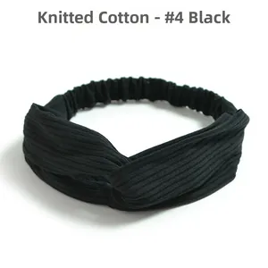 Detail of cross-knot design on black knitted cotton elastic headband for women