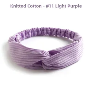 Detail of light purple knitted cotton twist knot headband with ribbed texture and elastic band