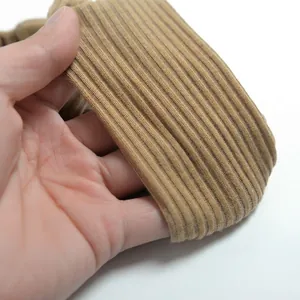 Elastic khaki ribbed knit cotton headband showing detailed texture and stretchability