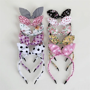 Set of colorful fabric bow headbands featuring striped, floral, and polka dot patterns