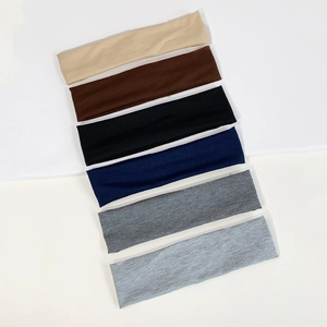 Set of six colorful elastic sport headbands for yoga and running in various neutral tones