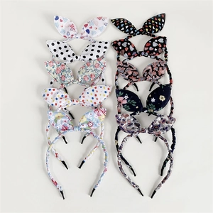 Set of 10 sweet fabric bow headbands with floral, polka dot, and heart patterns