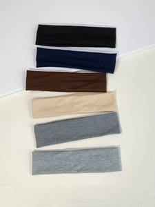 Detail view of 6cm elastic sports headbands in six different solid colors for yoga