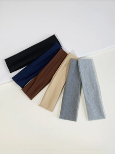 Detail view of 6-piece elastic sports headbands set in neutral multi-color tones