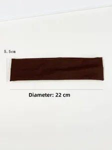 Detail shot of 5.5cm wide coffee brown elastic sports headband with size annotations