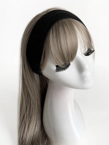 Detail view of 6cm wide black elastic yoga headband shown on a mannequin model