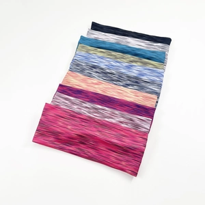 Macro detail of multi-color space-dyed athletic headbands with soft elastic texture