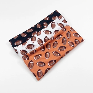Pack de tres cintas deportivas elásticas en negro, blanco y naranja con diseño de rugby