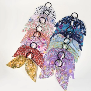 Close-up of 15-piece floral and leopard print bow scrunchie set with elastic hair ties
