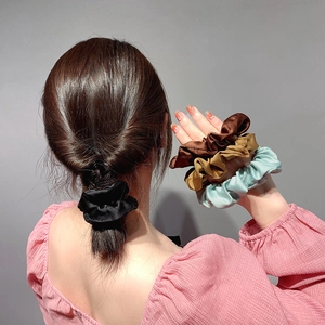 Minimalist silk satin scrunchies set in four colors for classic French hair styling