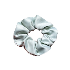 French style mint green silk scrunchie with a sleek satin finish and elegant pleats