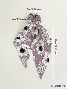Detail view of mauve floral hair scrunchie with long ribbons and size dimensions