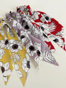 Floral print hair scrunchies with long ribbons in yellow, purple, and red chiffon fabric