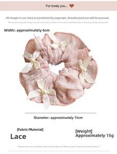 Detailed view of pink lace scrunchie with white satin bow and faux pearls, 15cm diameter