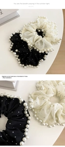Detail of mesh hair scrunchie with embroidered pearls and sparkling rhinestones