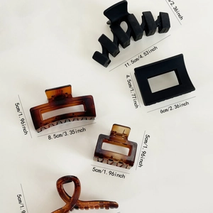 Hair claw clip set featuring matte black and tortoiseshell resin designs with dimensions