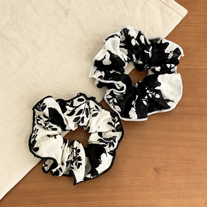 Set of two elegant black and white floral print chiffon scrunchies with ruffled edges