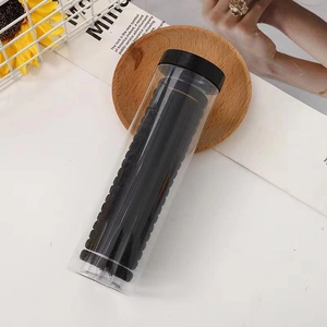 Transparent jar with high elasticity black seamless hair ties and sleek wavy texture