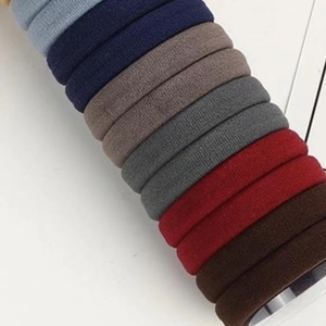 Detailed close-up showing the seamless knitted texture of multicolored elastic hair bands