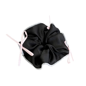 Elegant black satin scrunchie with pink ribbon bows and white stitched edges for women