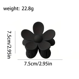 Detail view of matte black floral hair claw clip showing 7.5cm dimensions and 22.8g weight