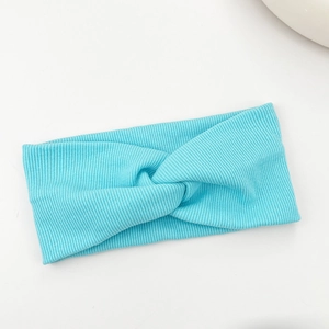 Detailed view of the ribbed knit texture and cross knot on the sky blue headband