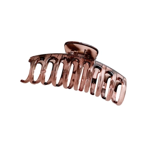 Large amber tortoiseshell hair claw clip with minimalist geometric design for women