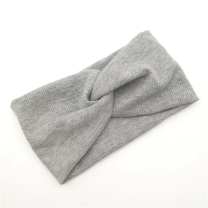 Light grey ribbed knit headband with twist knot design for yoga and sports