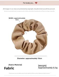 Detailed view showing a 10cm khaki pleated velvet scrunchie with soft striped texture