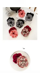 Detailed macro view of assorted plaid and solid fabric scrunchies with textile texture