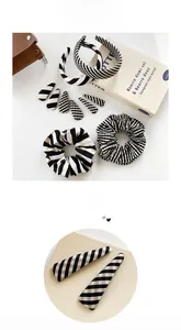 Detail of minimalist black and white striped hair accessories set on white background