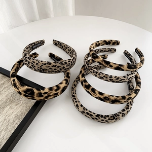 Set of 6 handmade leopard print headbands in assorted widths on a white surface