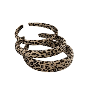 Three leopard print headbands in varying widths with handmade fabric finish details
