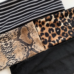 Yoga sports headband set featuring bohemian paisley, leopard print, and solid black designs