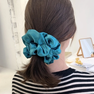 Teal oversized satin scrunchie shown in high ponytail hairstyle for daily hair styling