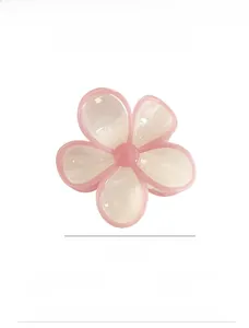 Detail showing a 7cm pink flower hair claw clip with size and weight measurements