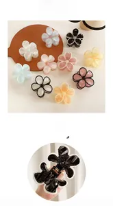 Detail of five-petal flower hair claw clips in macaron colors with metal spring mechanism