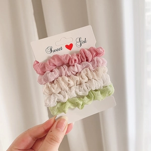 Set of 4 pastel chiffon scrunchies in pink and green on a Sweet Girl card holder