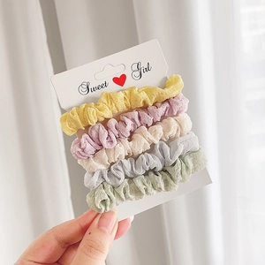 Detailed close-up of 5 candy-colored chiffon scrunchies on a Sweet Girl display card