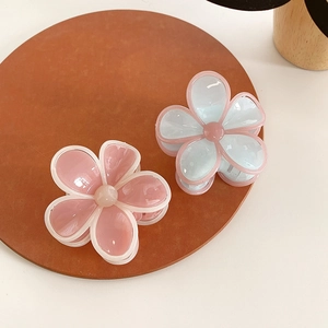 Floral hair claw clips in pink and blue jelly colors for elegant updos hairstyles
