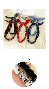 Detailed set of multi-color paisley print knotted headbands with elastic back