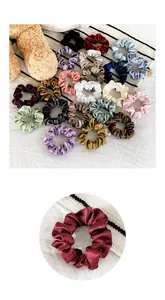 Macro detail of high-elasticity satin scrunchies set in various elegant solid colors